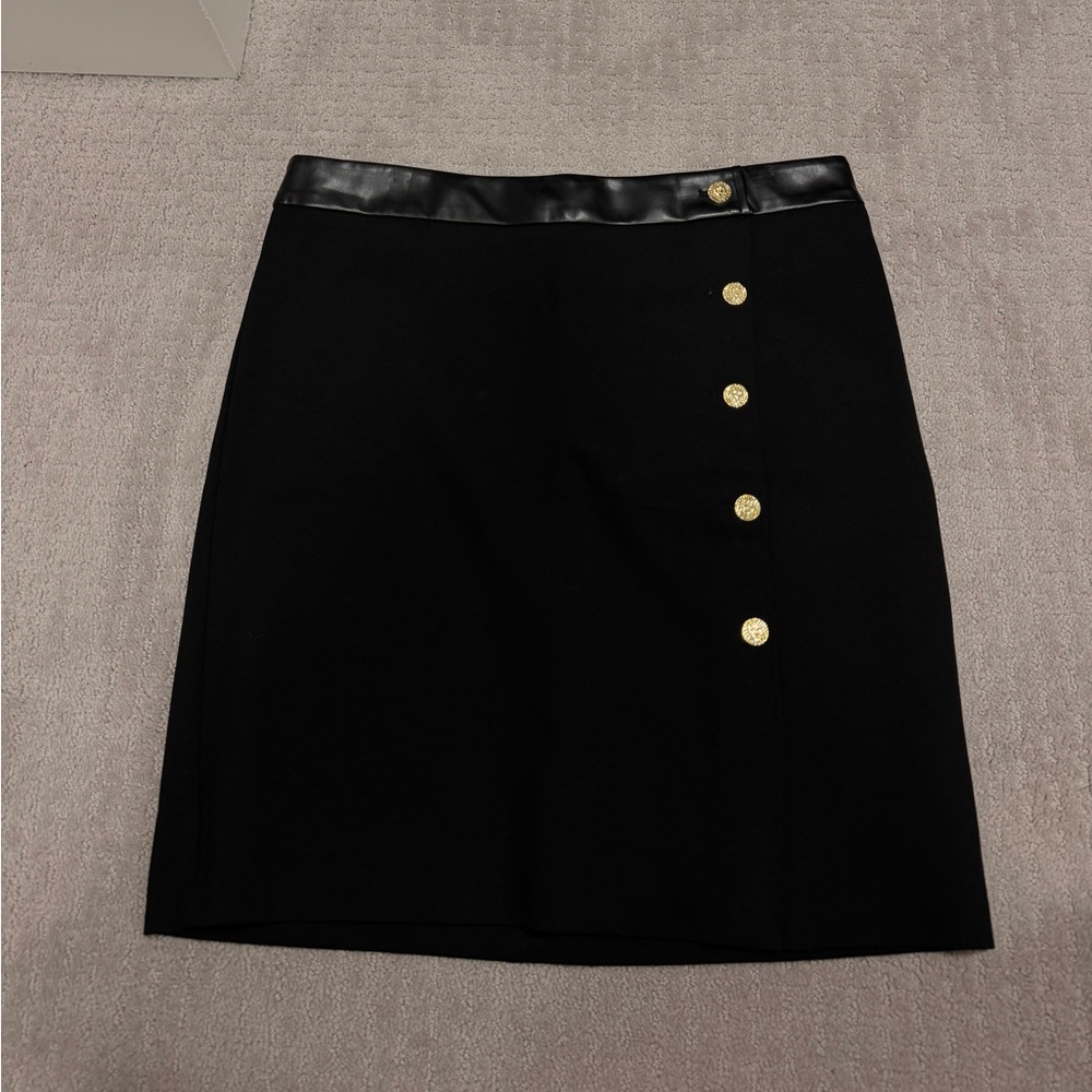 black skirt with gold details
